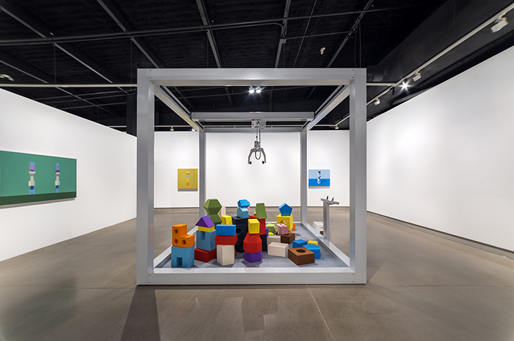 installation view, Jennifer Marman and Daniel Borins, Balancing act (installation with giant claw machine sculpture and paintings that depict the shapes from the machine), 2023, Contemporary Calgary.